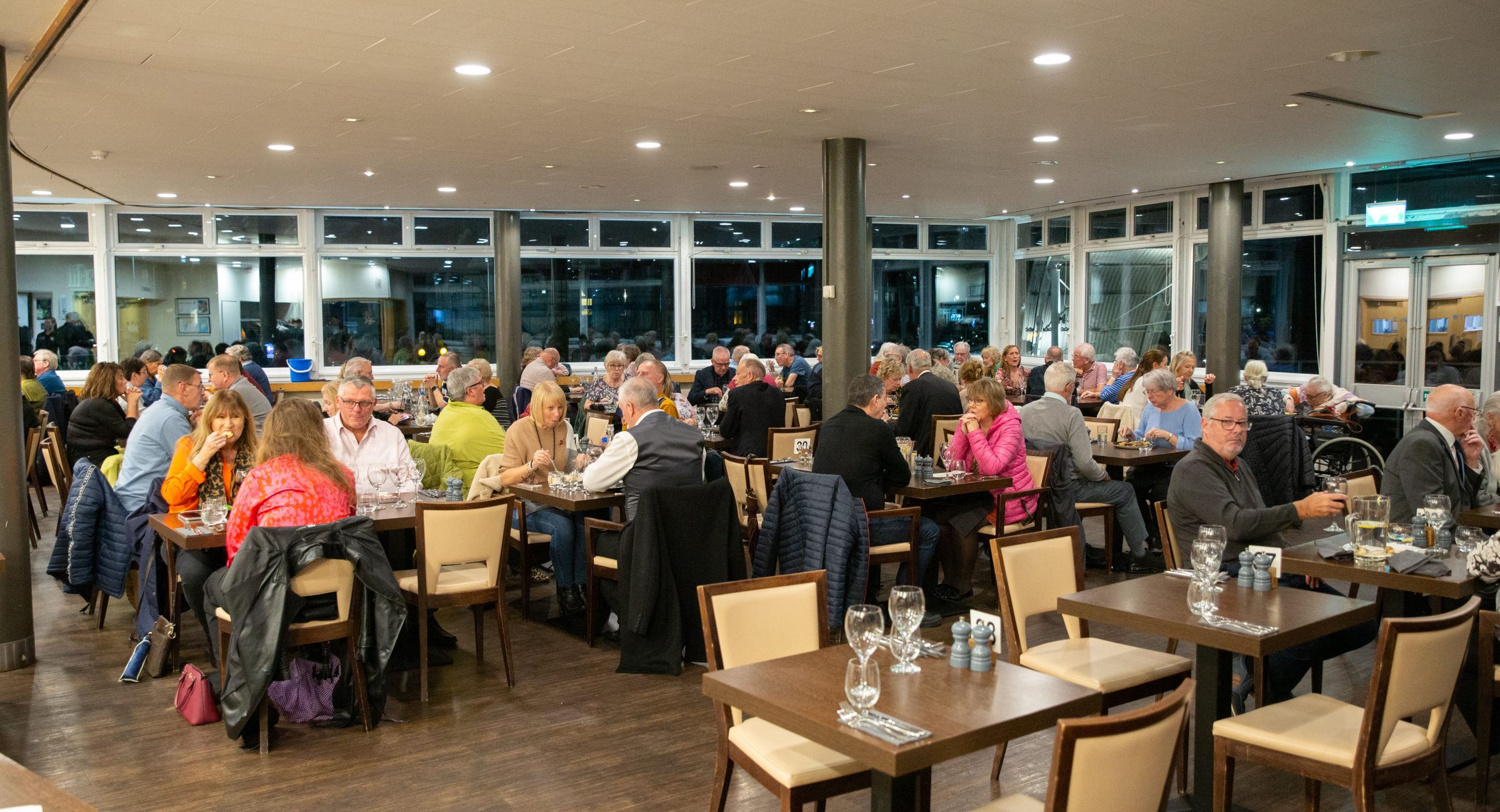 Guests sitting in the centre of a restaurant.